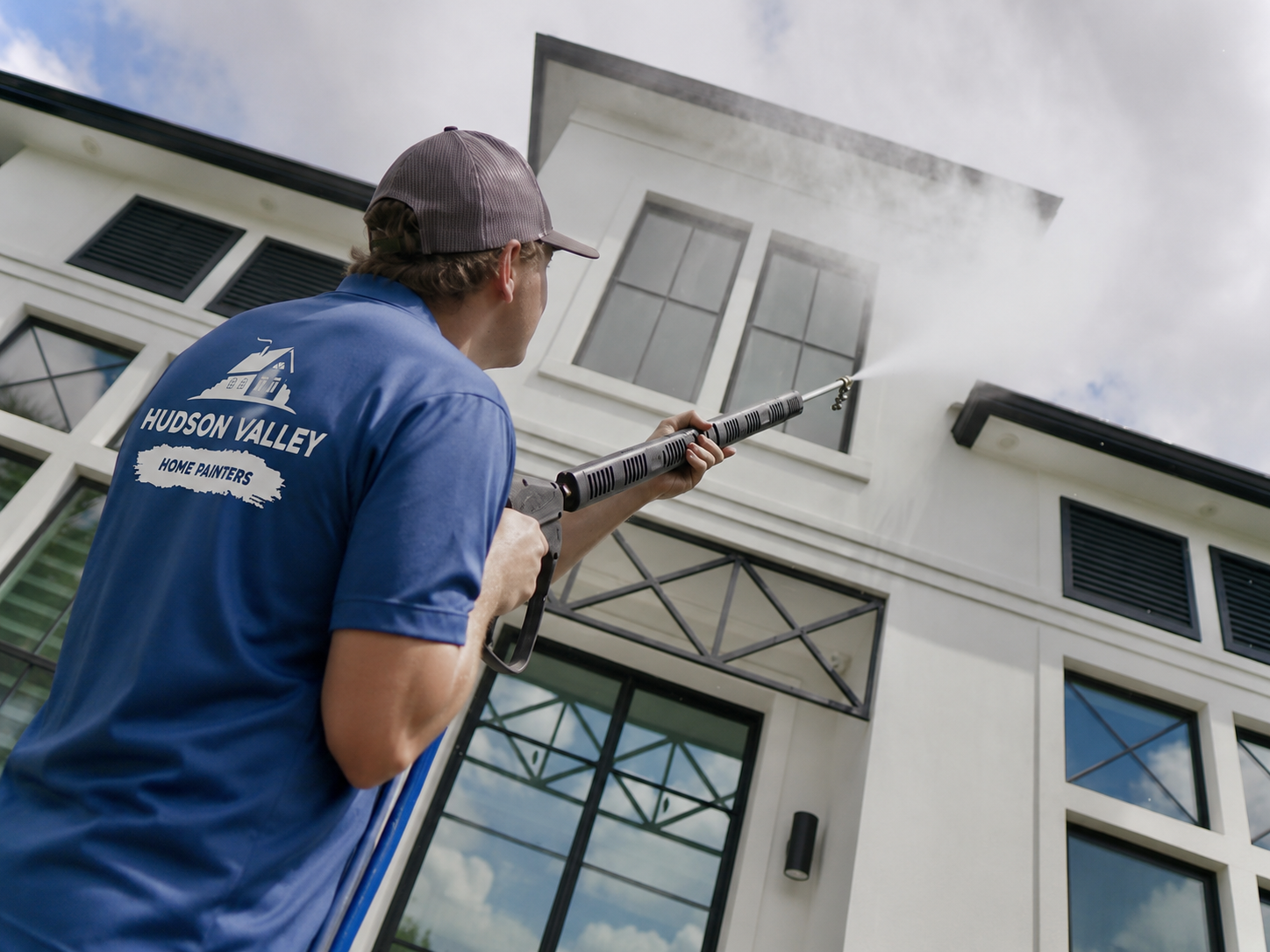 Pressure washing exterior siding and upper home surfaces